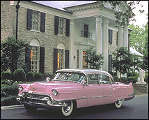 Elvis Presley's mansion, Graceland, with a pink Cadillac parked out front.