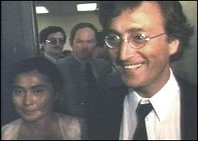 John Lennon beams as he and his wife, Yoko Ono, meet the press on John getting his Green Card. Lennon's battle with US Immigration is finally over.