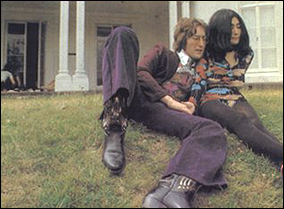 John Lennon and Yoko Ono pose for a photo on the grounds of their Tittenhurst mansion.