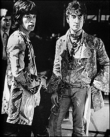 John Lennon, right, with Mick Jagger at the television broadcast of All You Need Is Love on the Our World special.