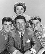 The Nelson Family, from left to right: Ricky Nelson, Harriet Nelson, Ozzie Nelson, and David Nelson.