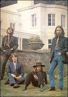The Beatles post in front of John's home, Tittenhurst Park, in 1969.