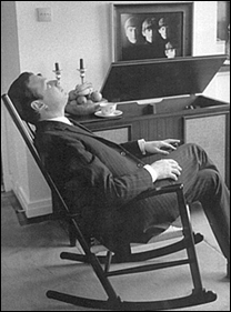 Brian Epstein relaxes in his London home.