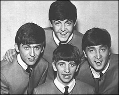 The Beatles in their high-fashion collarless suits in 1963.