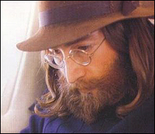 John Lennon spends his time reading on one of the many jet-set flights he took in the late 1960s.